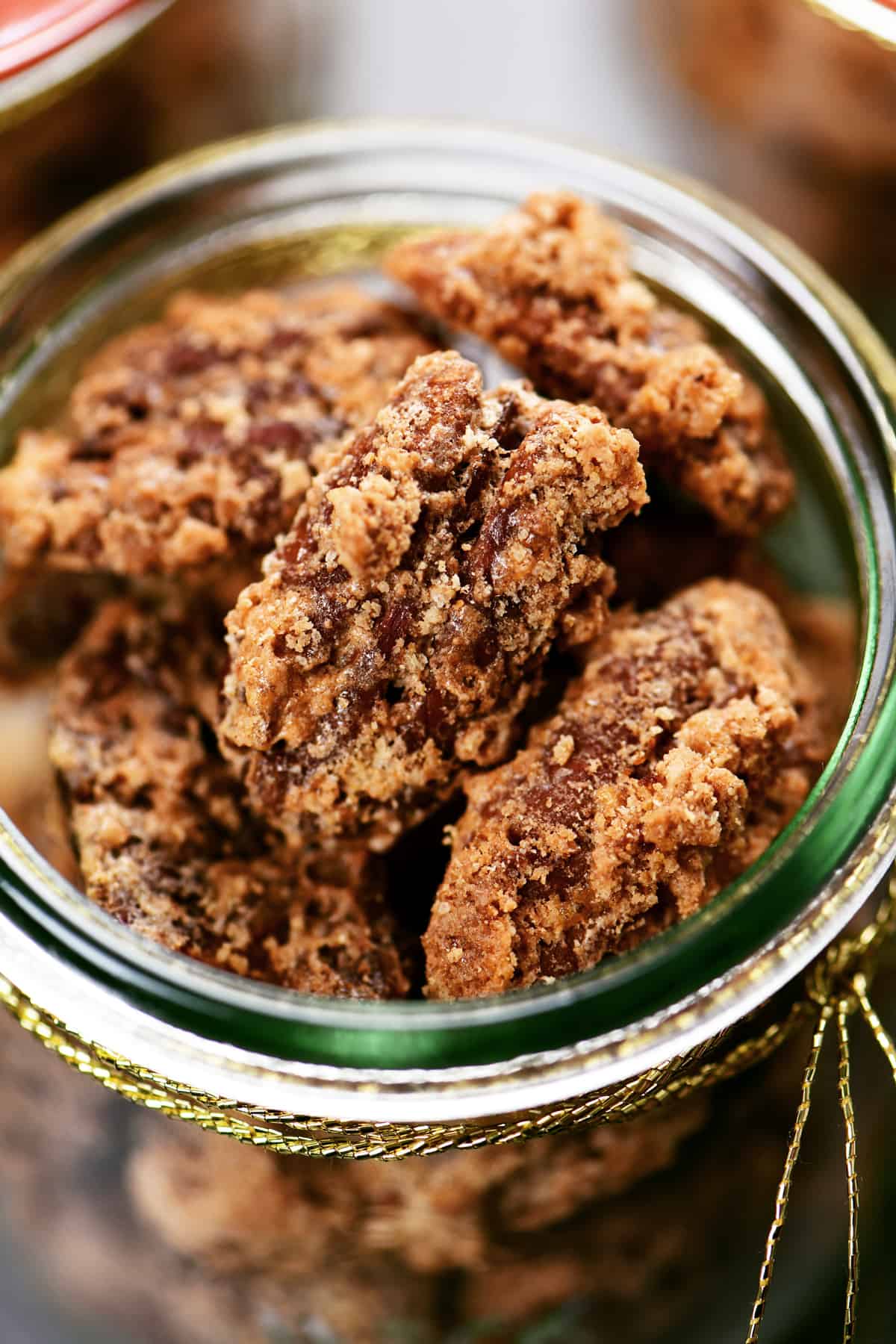 top down view of candied pecans in a mason jar.