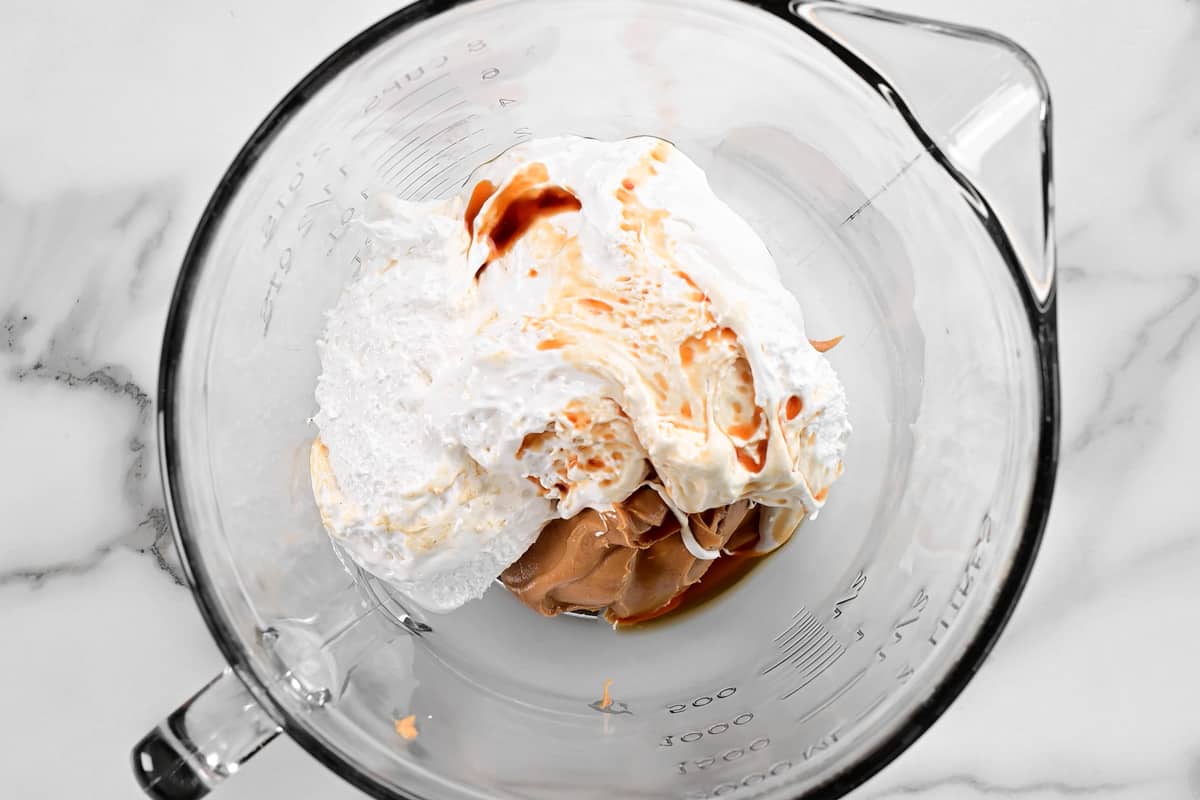 peanut butter, marshmallow cream, and vanilla in a bowl.