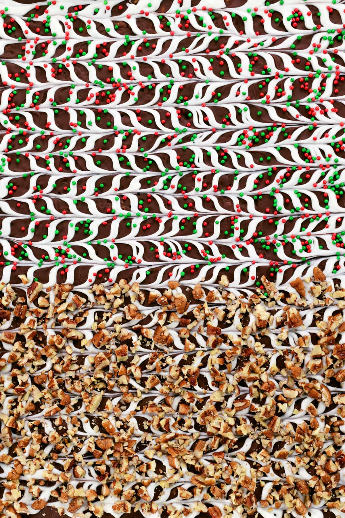christmas crack topped with sprinkles and chopped pecans.