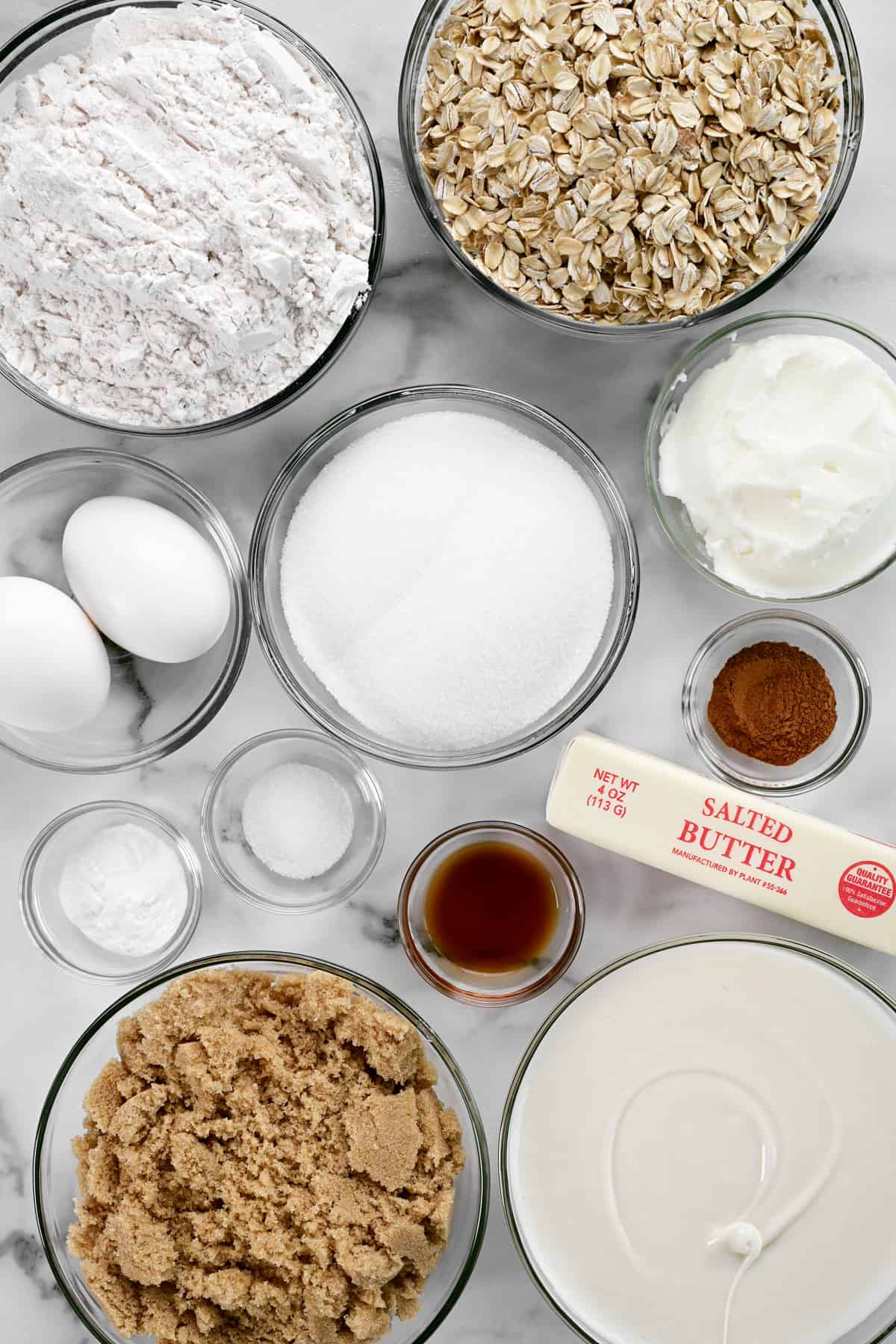 ingredients in bowls on a marble countertop.