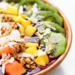 acai bowl with tropical fruit on top.