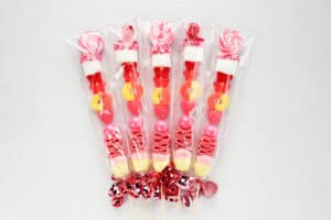 candy kabobs wrapped in cellophane with ribbons.