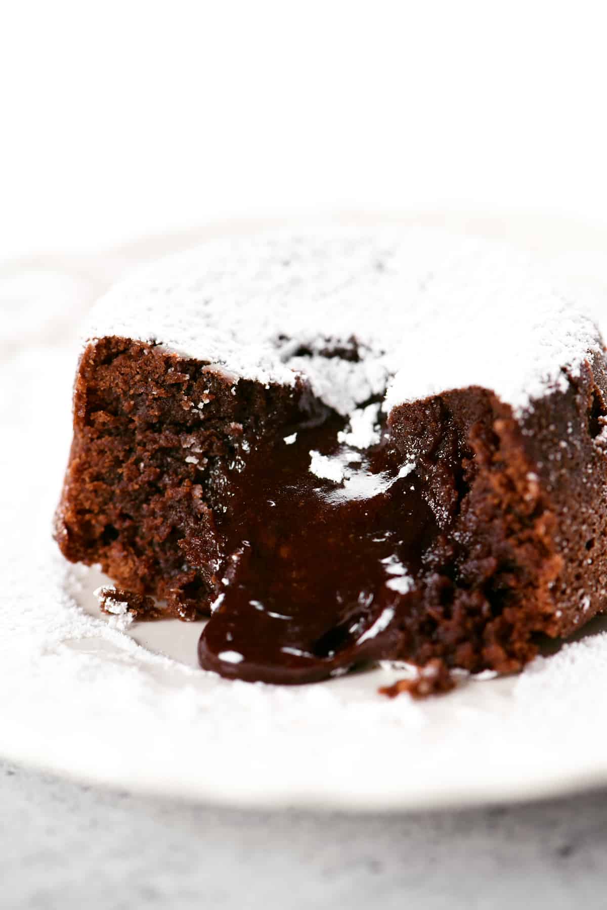 filling oozes out of a chocolate lava cake.