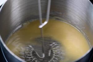 whisking a roux in a sauce pan.