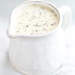 homemade poppy seed dressing in a small white pitcher.