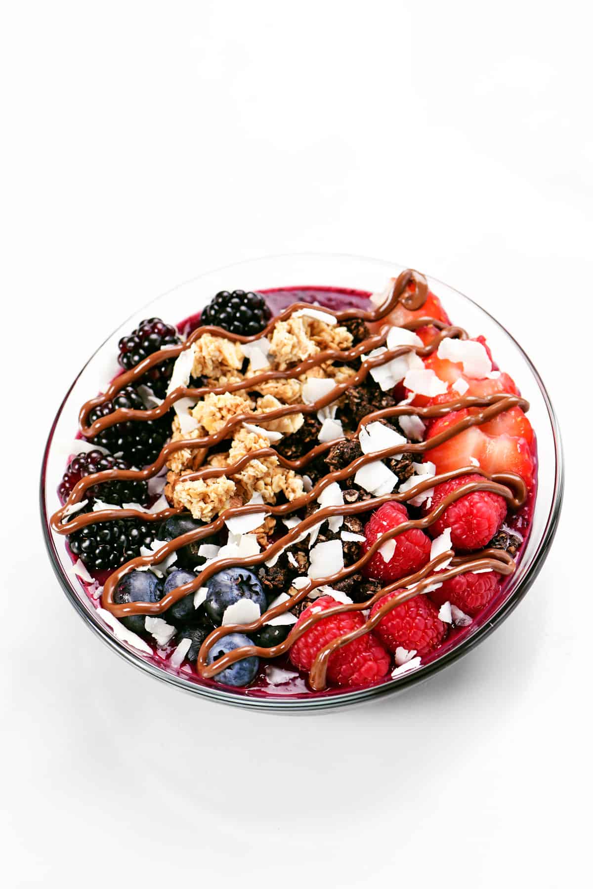 berries and granola with a chocolate topping.