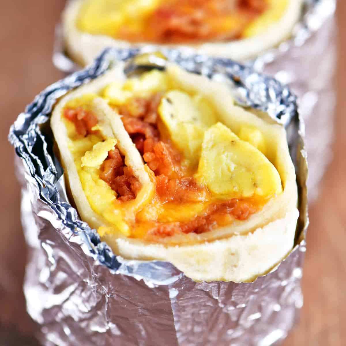 bacon egg and cheese breakfast burrito wrapped in foil.