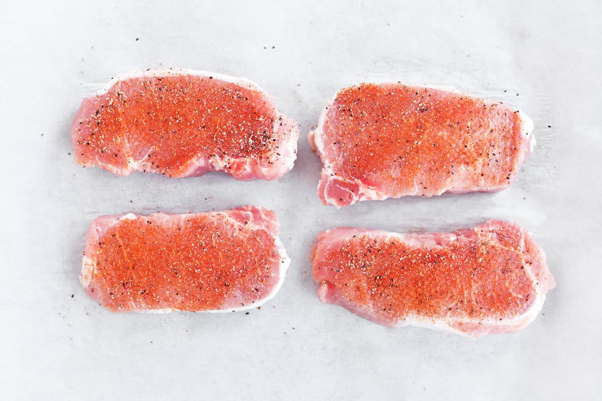 Four seasoned pork chops.