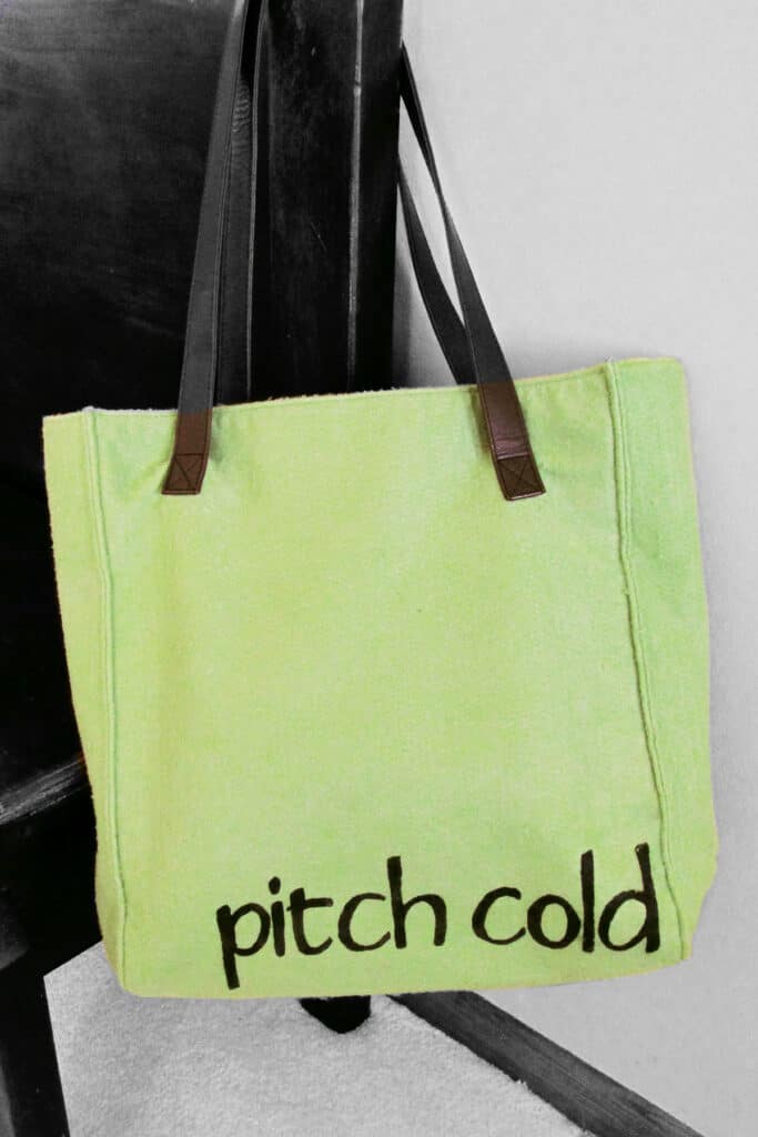 freezer paper stenciling on a green felt bag