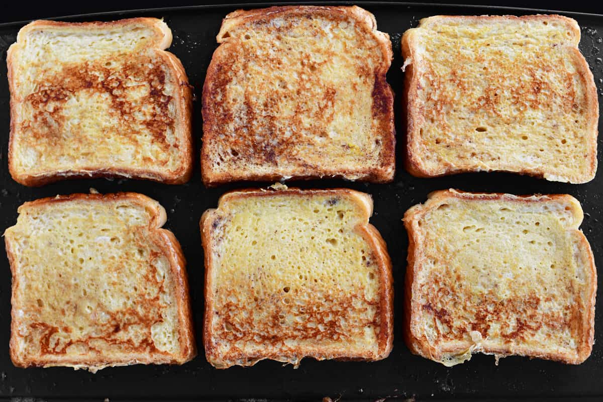 golden brown French toast on griddle.