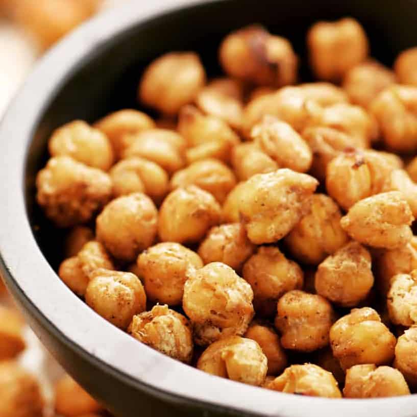 roasted chickpeas in a black bowl.