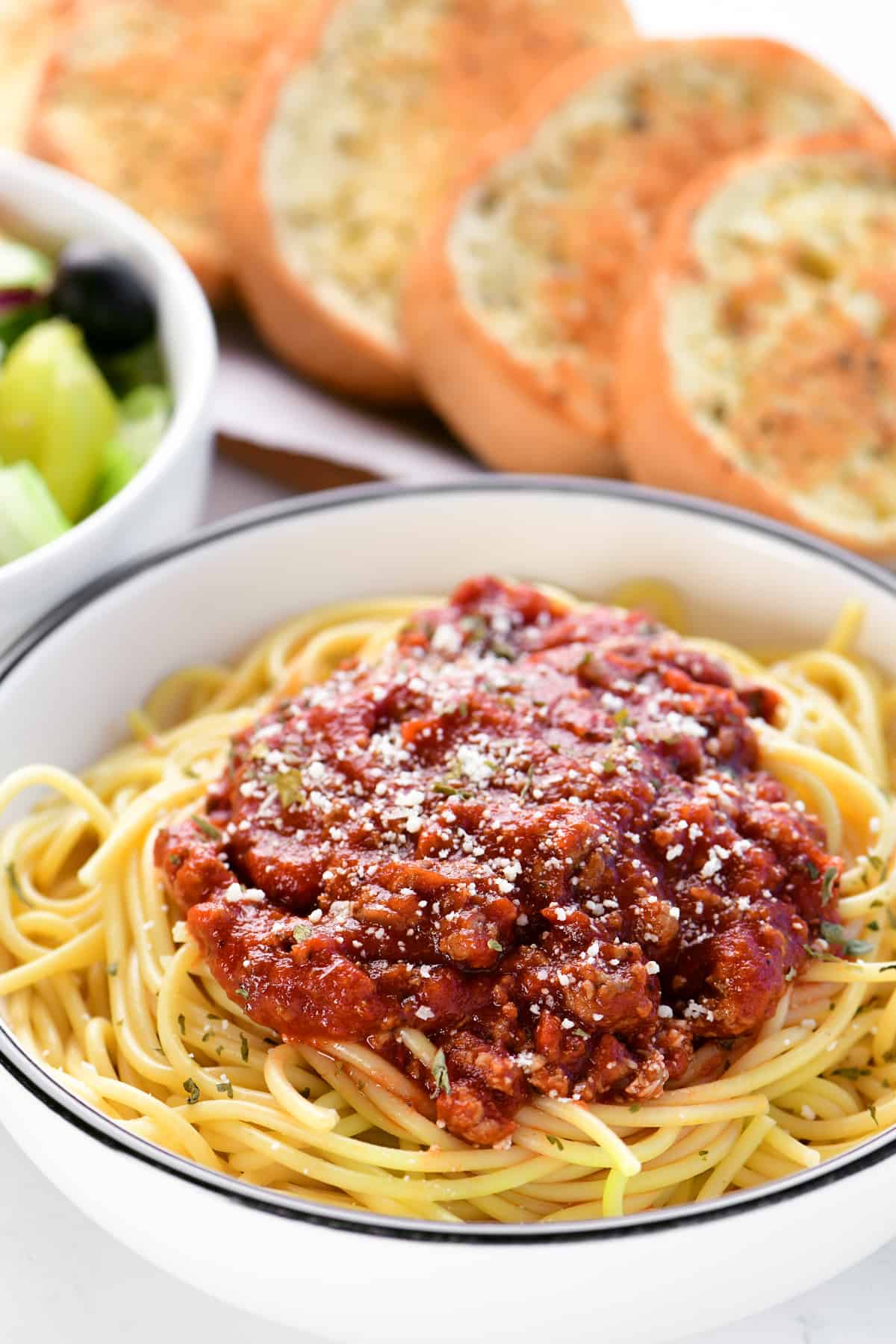 a bowl of noodles with Spaghetti sauce.