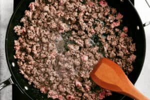 browning taco meat in a skillet.