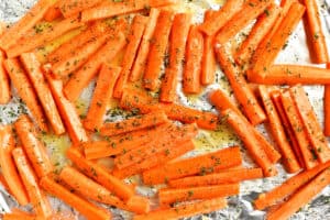 Seasoned carrots on a pan.