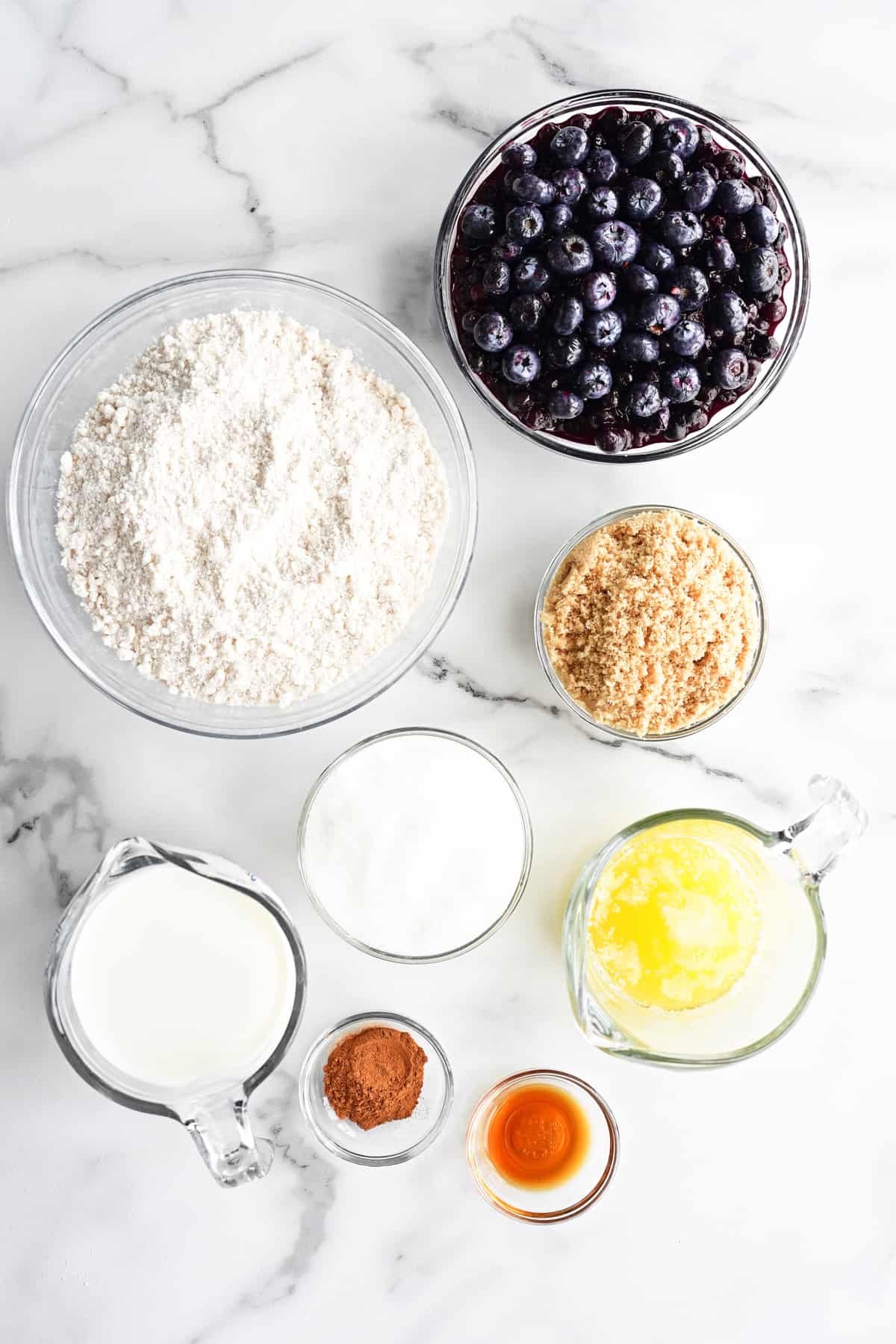 ingredients in bowls on a white countertop.