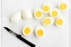Cut hard-boiled eggs in half.