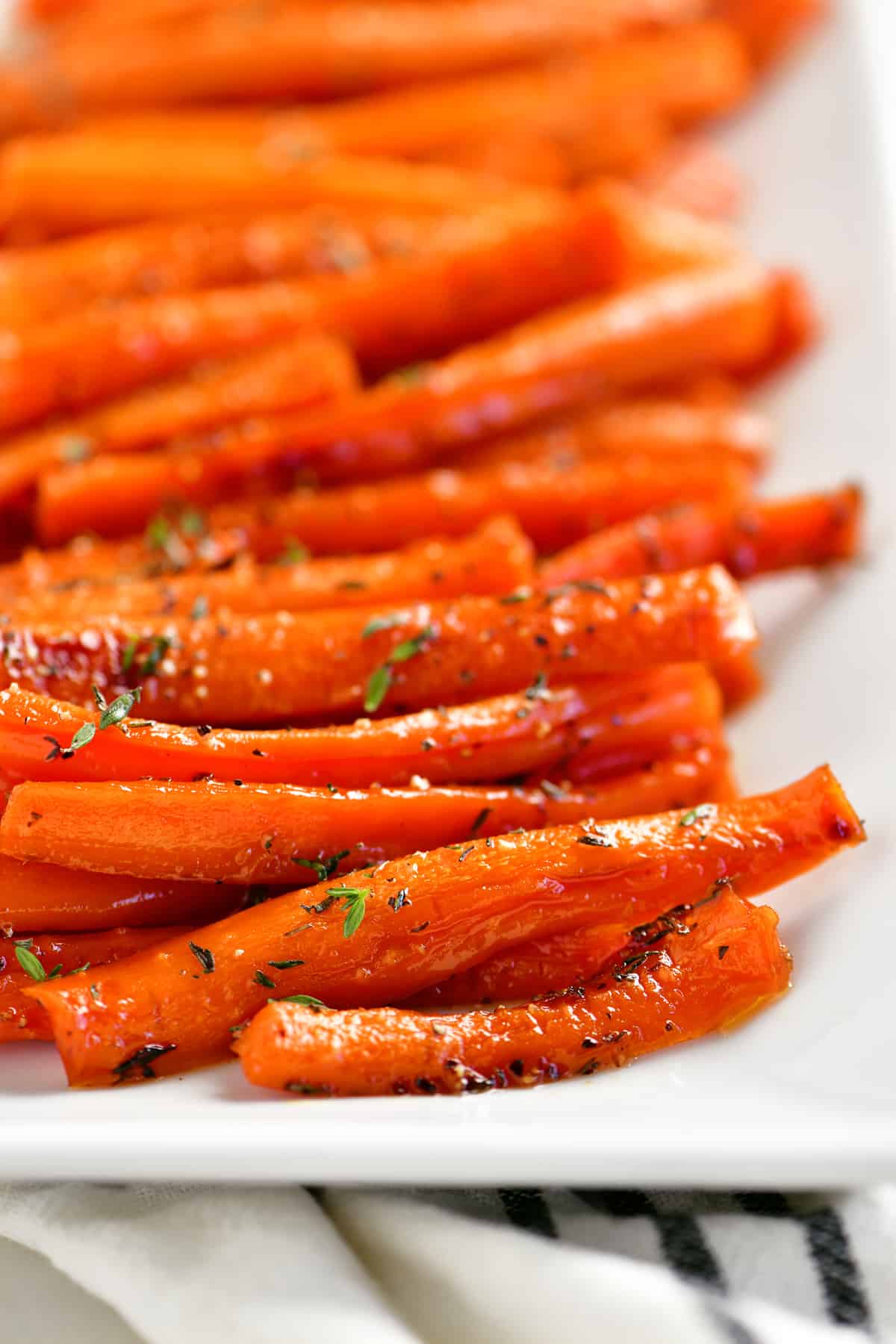 honey roasted carrots on a white platter.