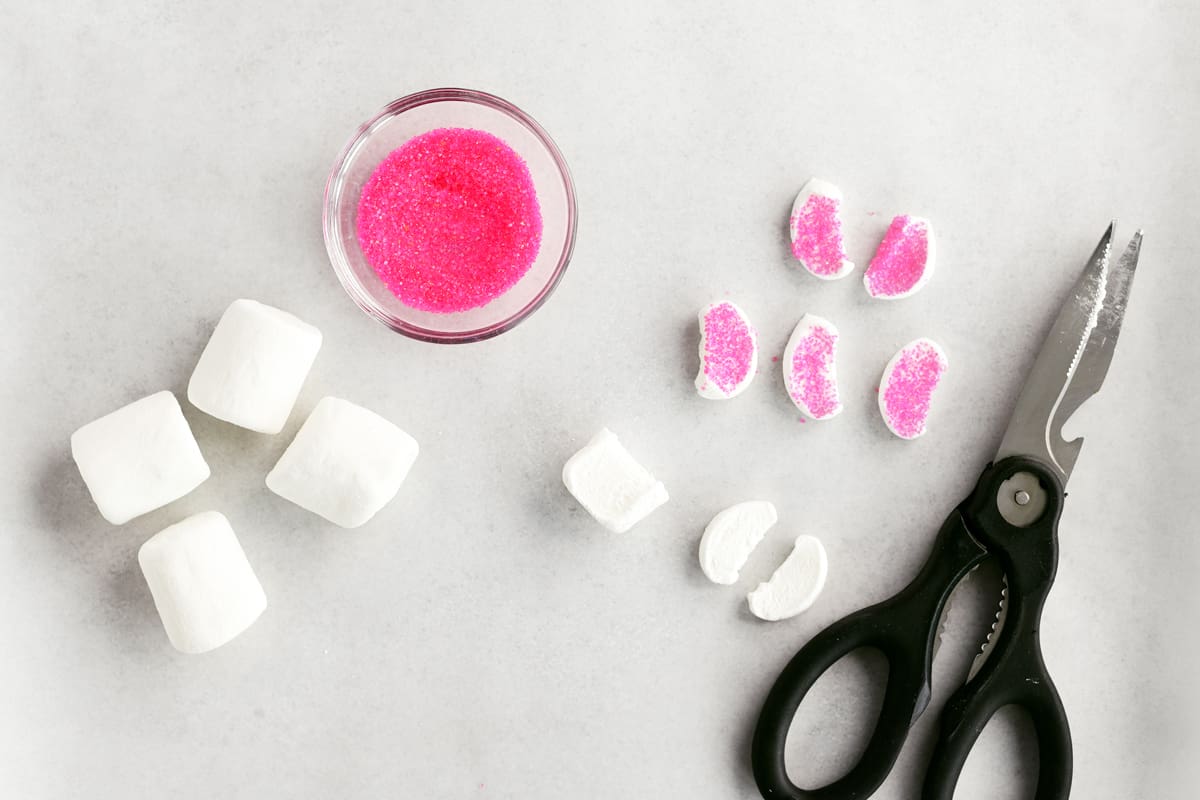 cutting marshmallows and adding sprinkles.