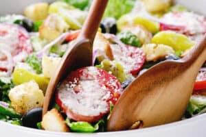 serving copycat Olive Garden salad.
