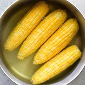 Boiled corn on the cob in a pot.