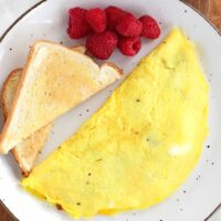 berries, an omelette and toast.