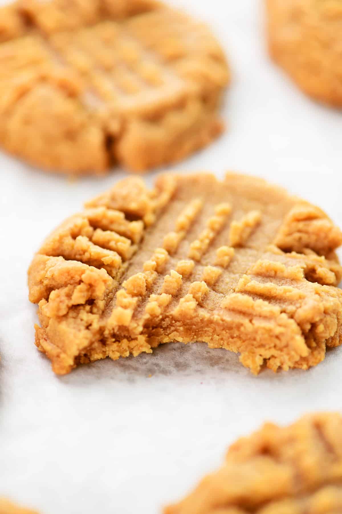 A bite out of a four ingredient peanut butter cookie.