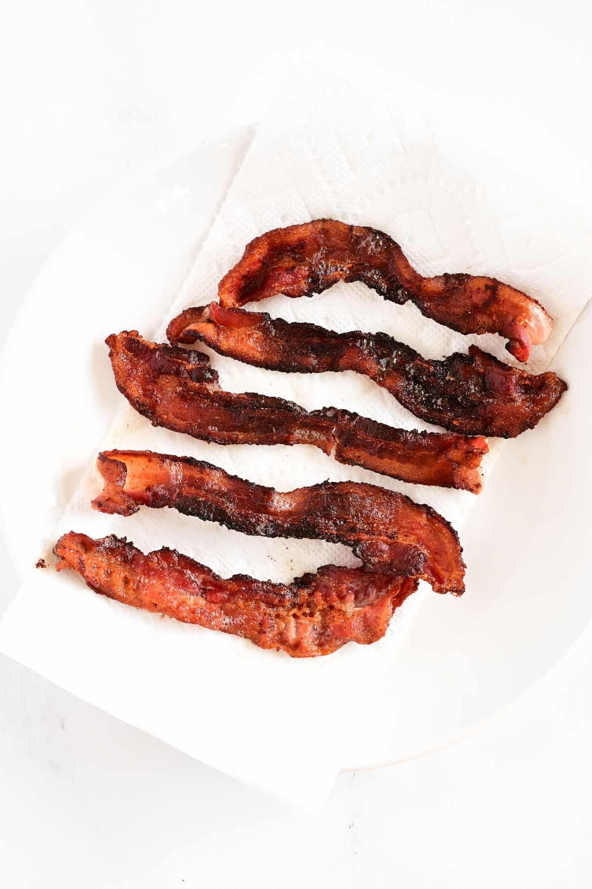 Five strips of cooked bacon.
