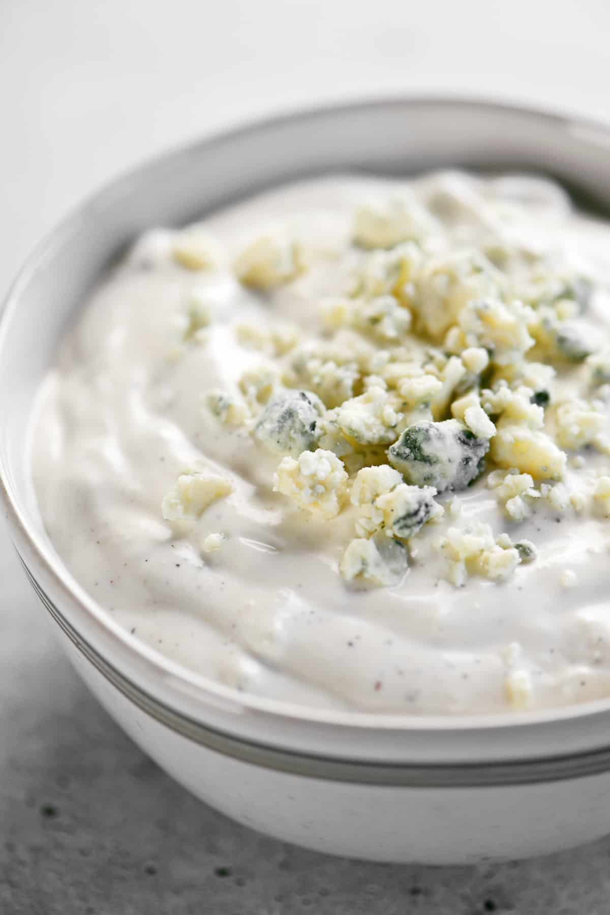 Blue Cheese dipping sauce in a white bowl.