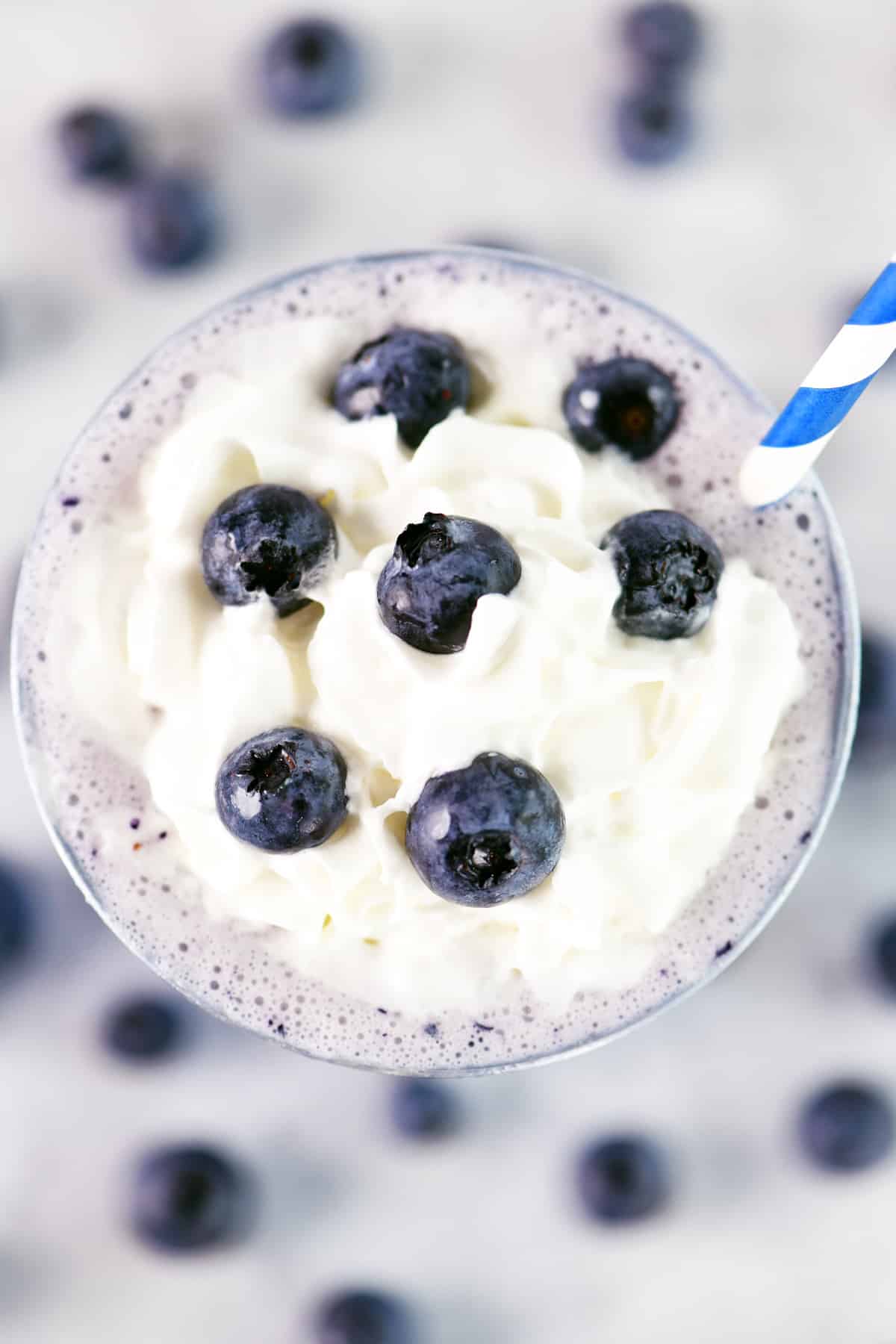Whipped cream on top with fresh blueberries.