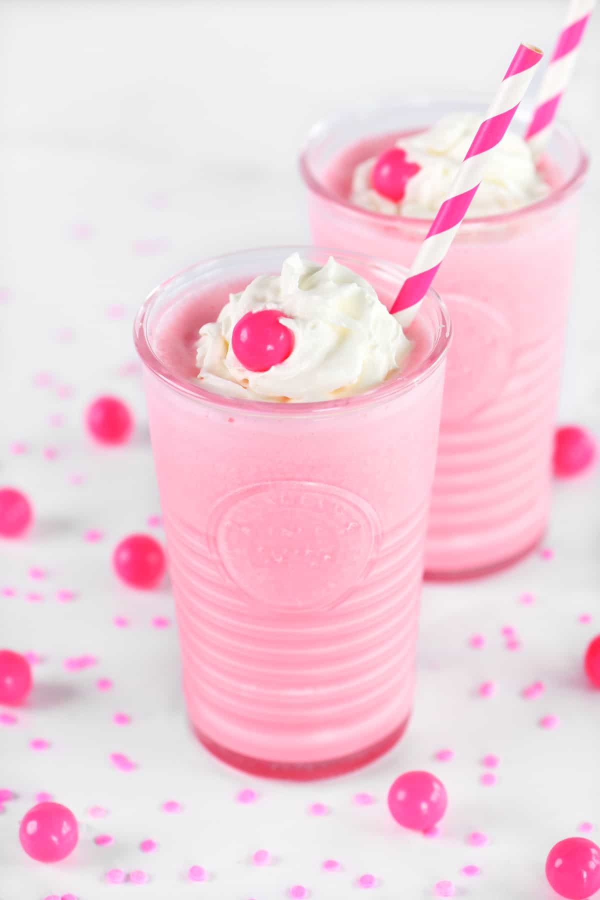Pink bubblegum milkshakes in glasses.