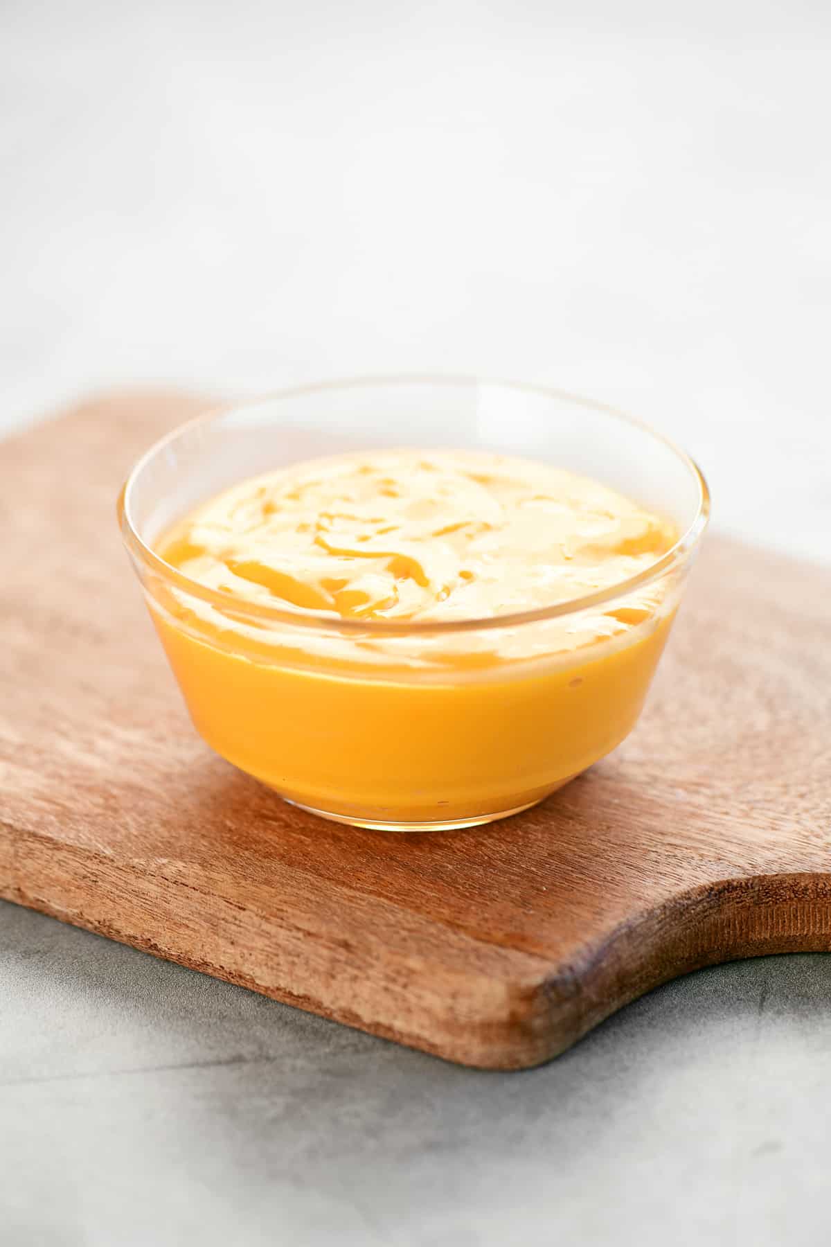 Cheese sauce in a plastic dipping bowl.