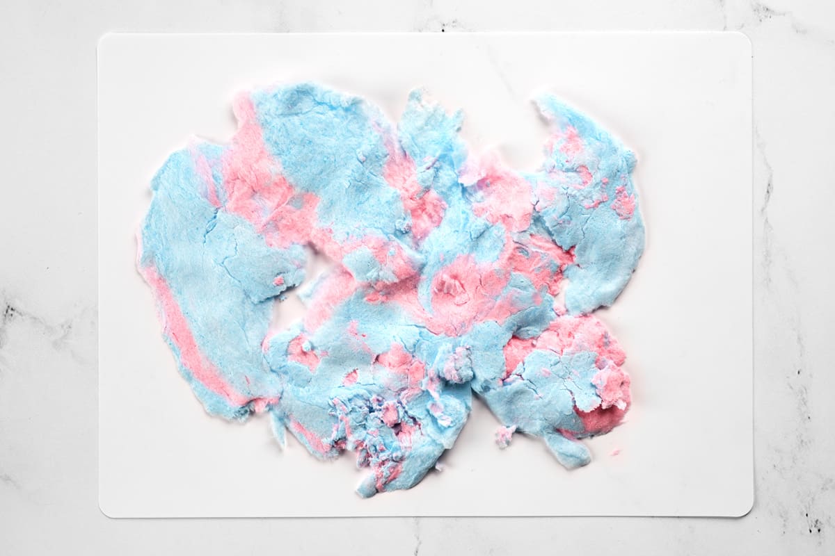 Smashed cotton candy on a cutting board.