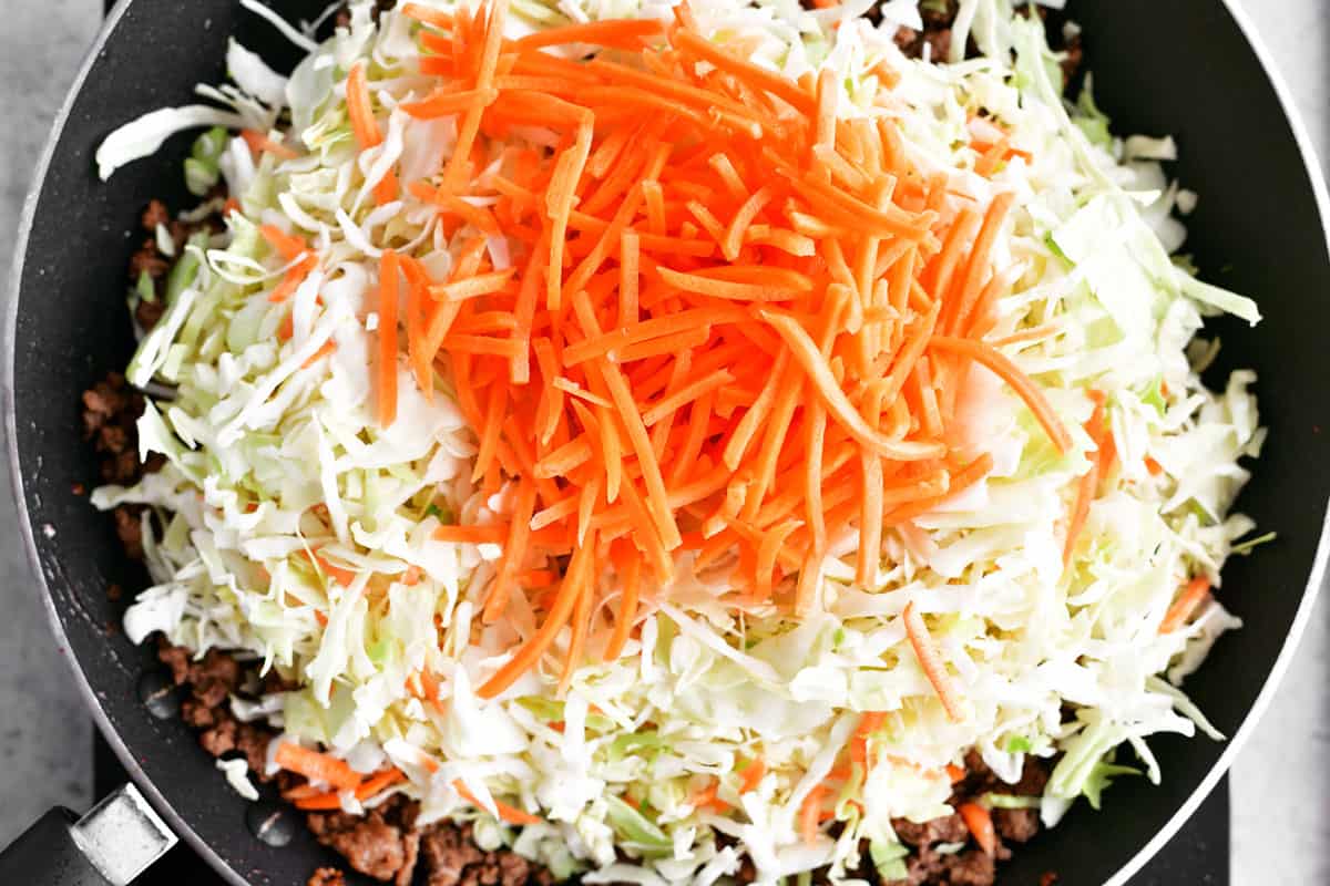 Add shredded carrots and shredded cabbage.