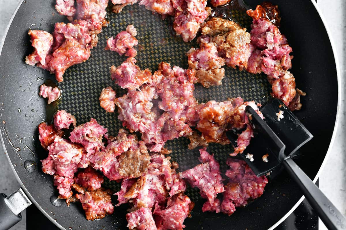 Ground beef and ground pork in a skillet.