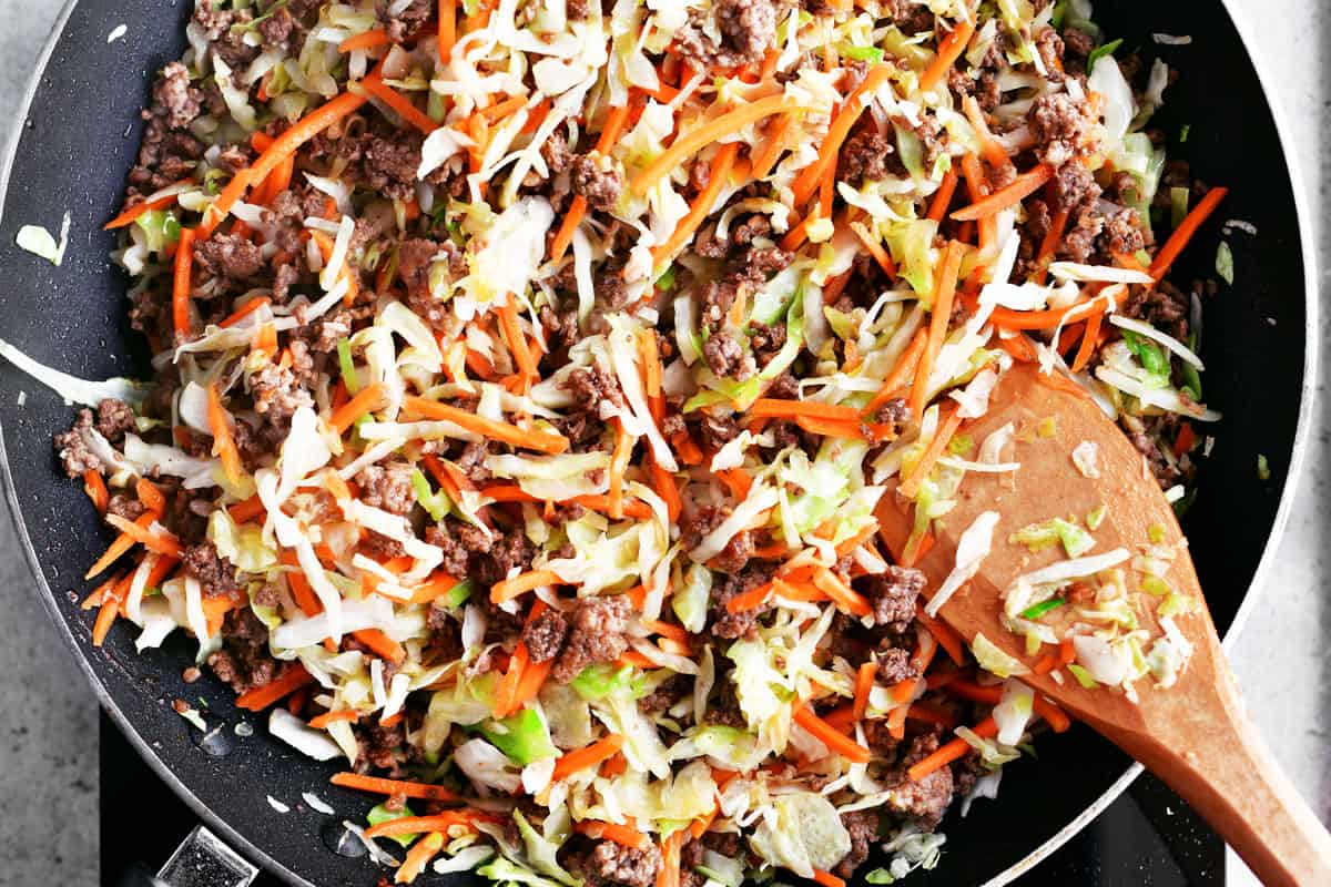 Stir in shredded cabbage and carrots.