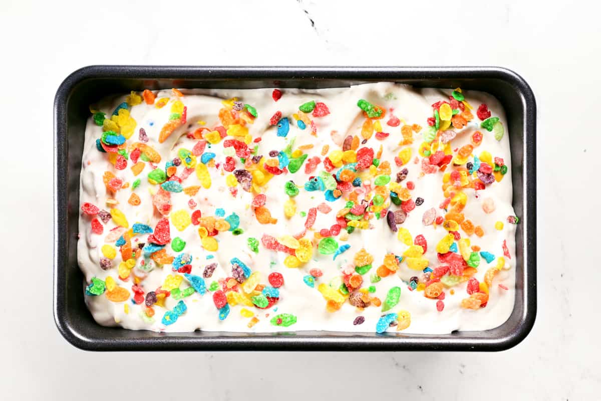 Ice Cream in a metal pan with colorful cereal sprinkled on top.