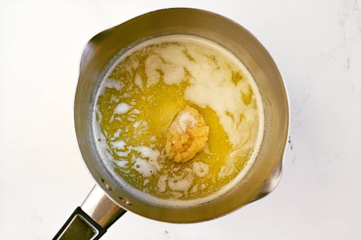 Butter and garlic in a saucepan.