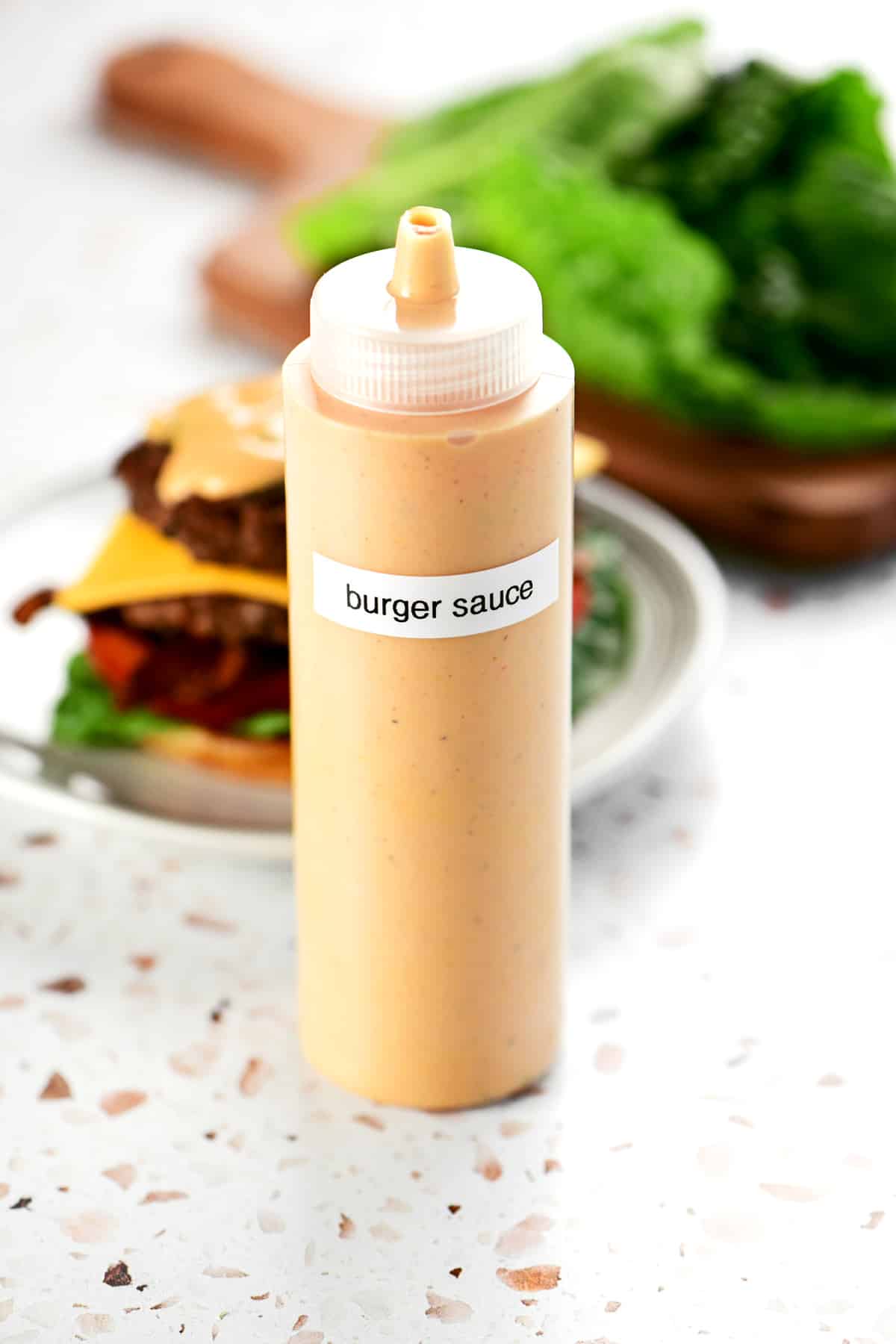 A condiment bottle with burger sauce inside.