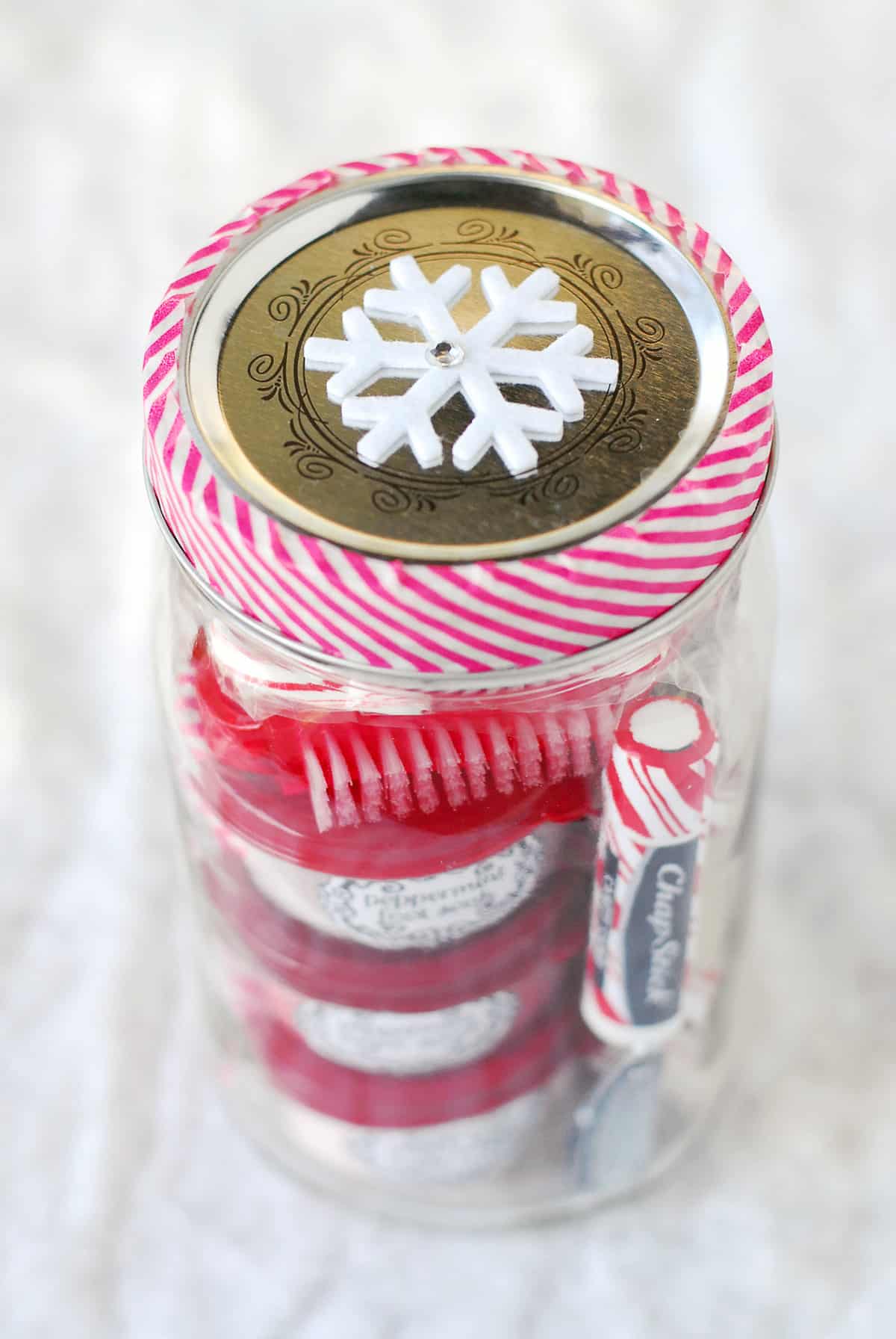 Add a snowflake to the top of the jar.