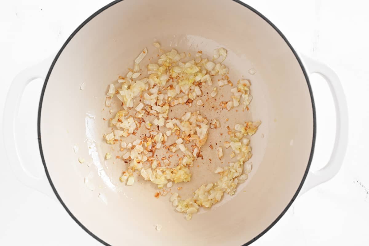 diced onions in a pot.