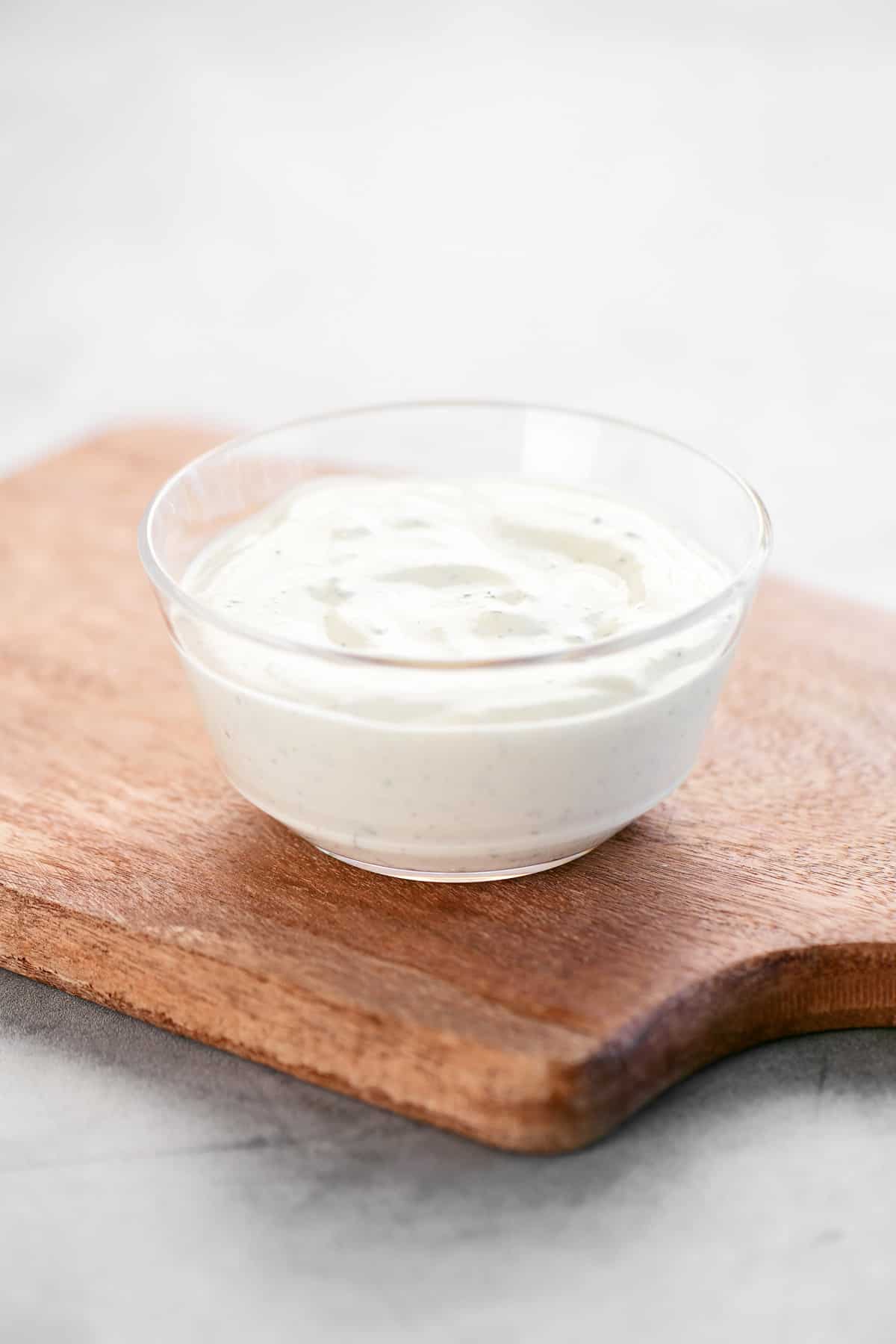 Ranch sauce in a plastic dipping bowl.