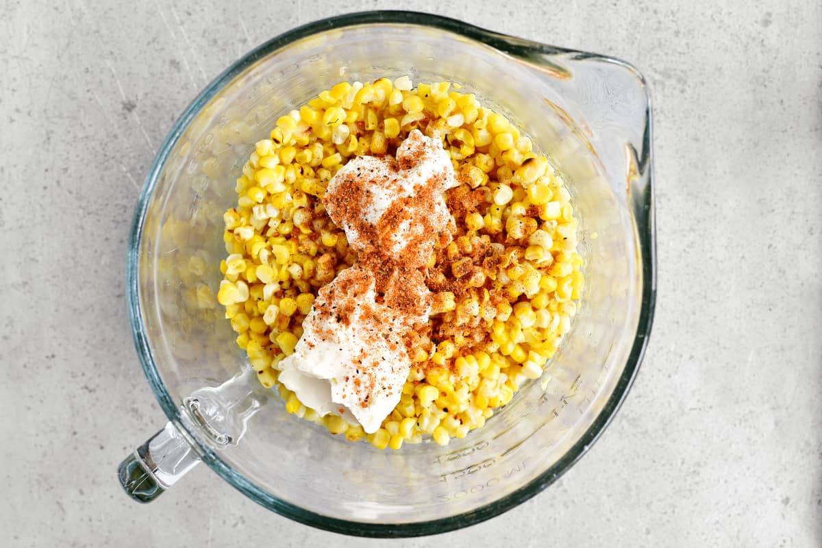 Add elote seasoning to the bowl.