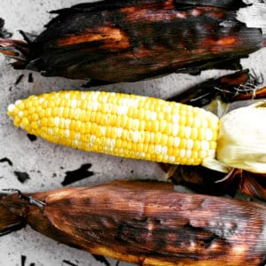 Grilled corn in the husks.