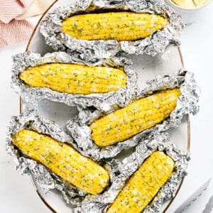 Grilled corn on the cob in foil.