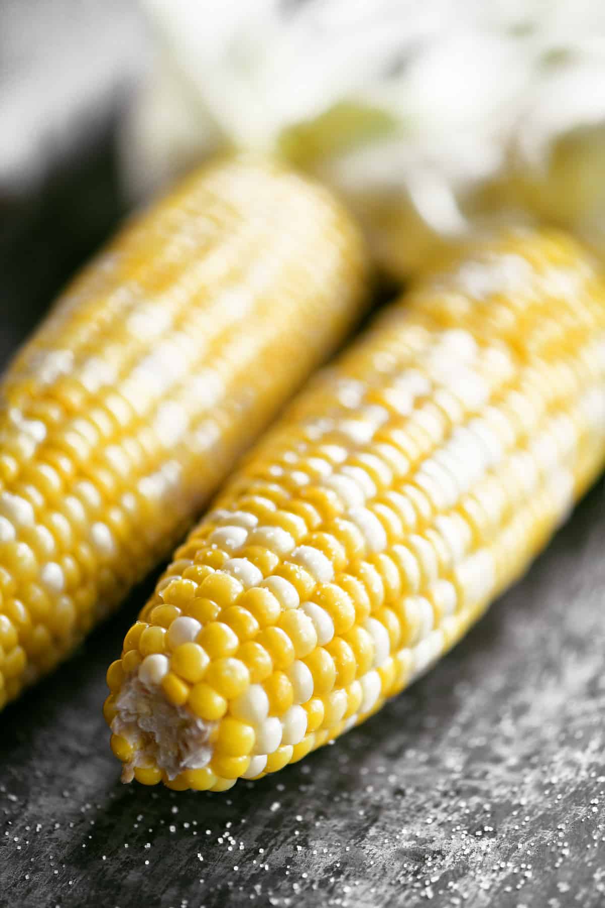Two corn on the cob.