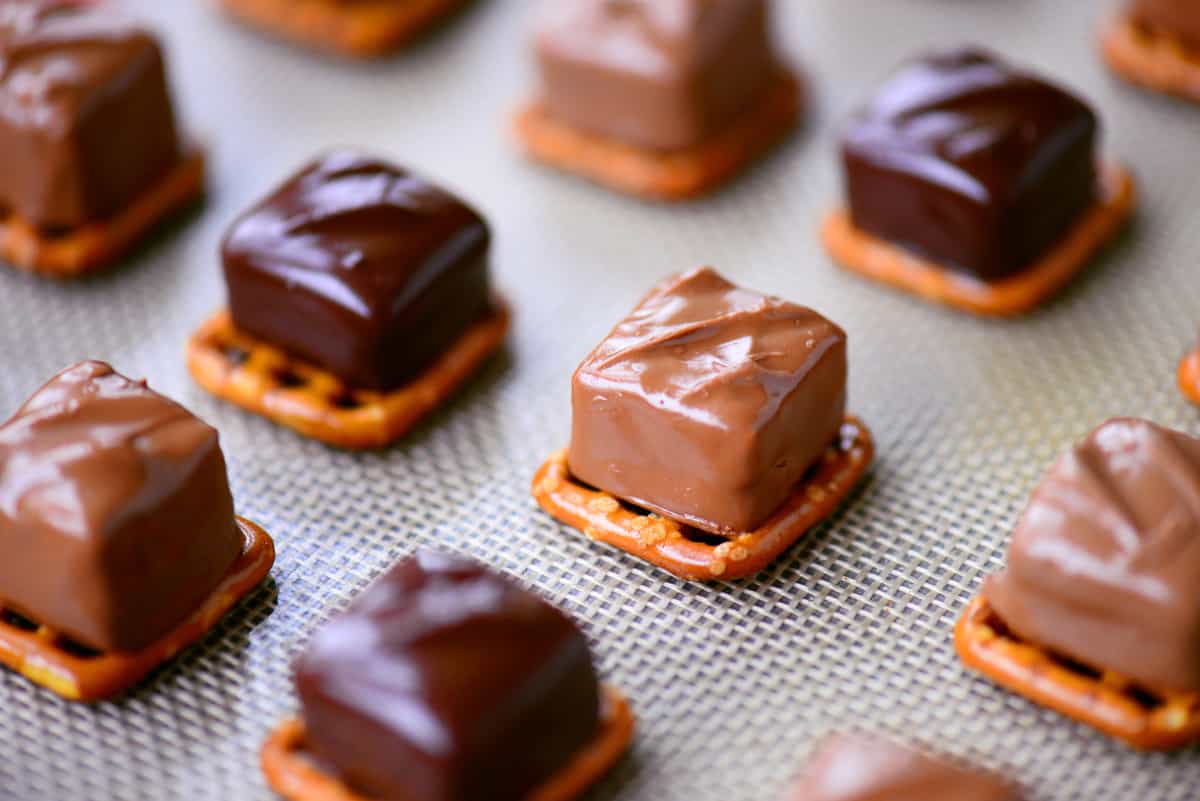 Softened candy bars on pretzels.