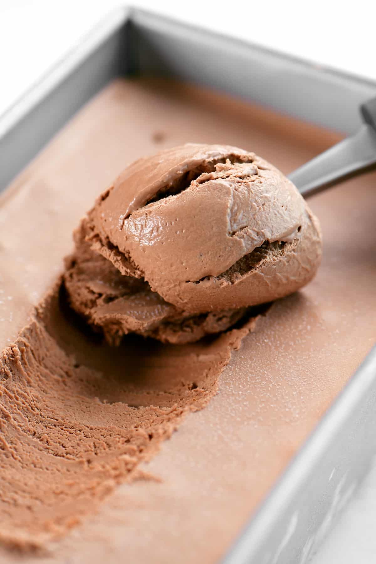 A scoop of no churn chocolate ice cream.