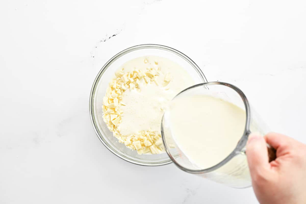 Pour heavy cream over the chopped white chocolate.