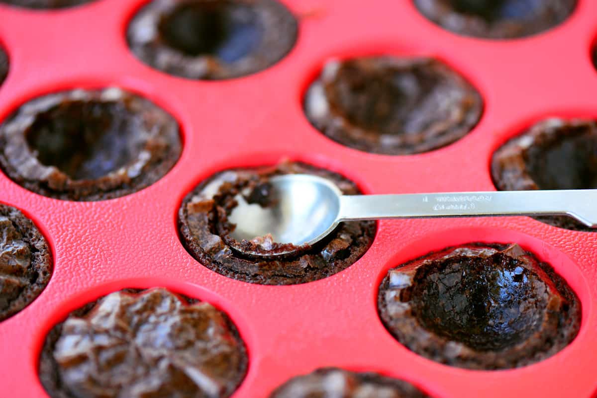 Using a teaspoon to make an indent.