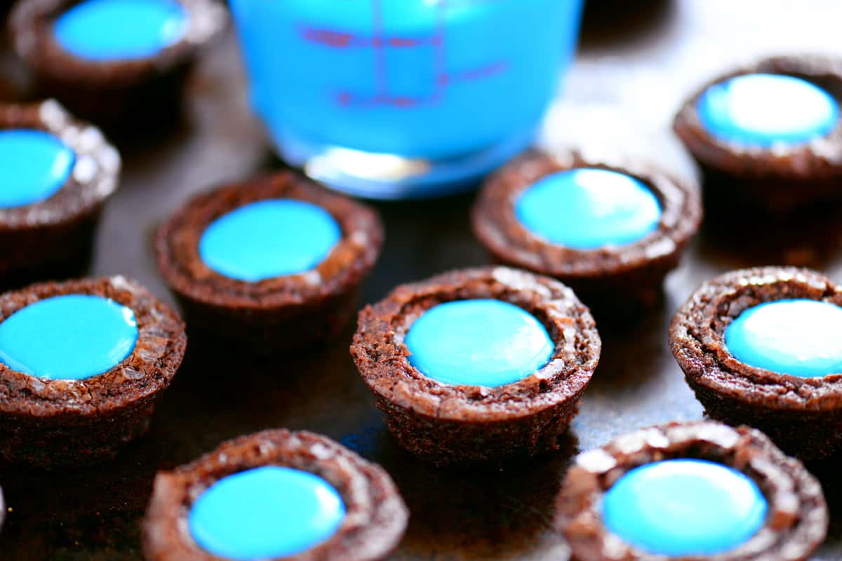 Brownie bites filled with blue frosting.